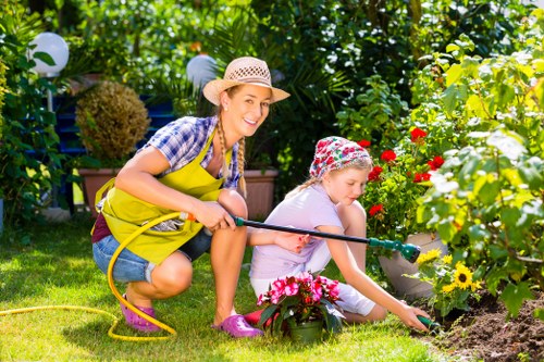 Supervisor checking safe working practices during landscaping work